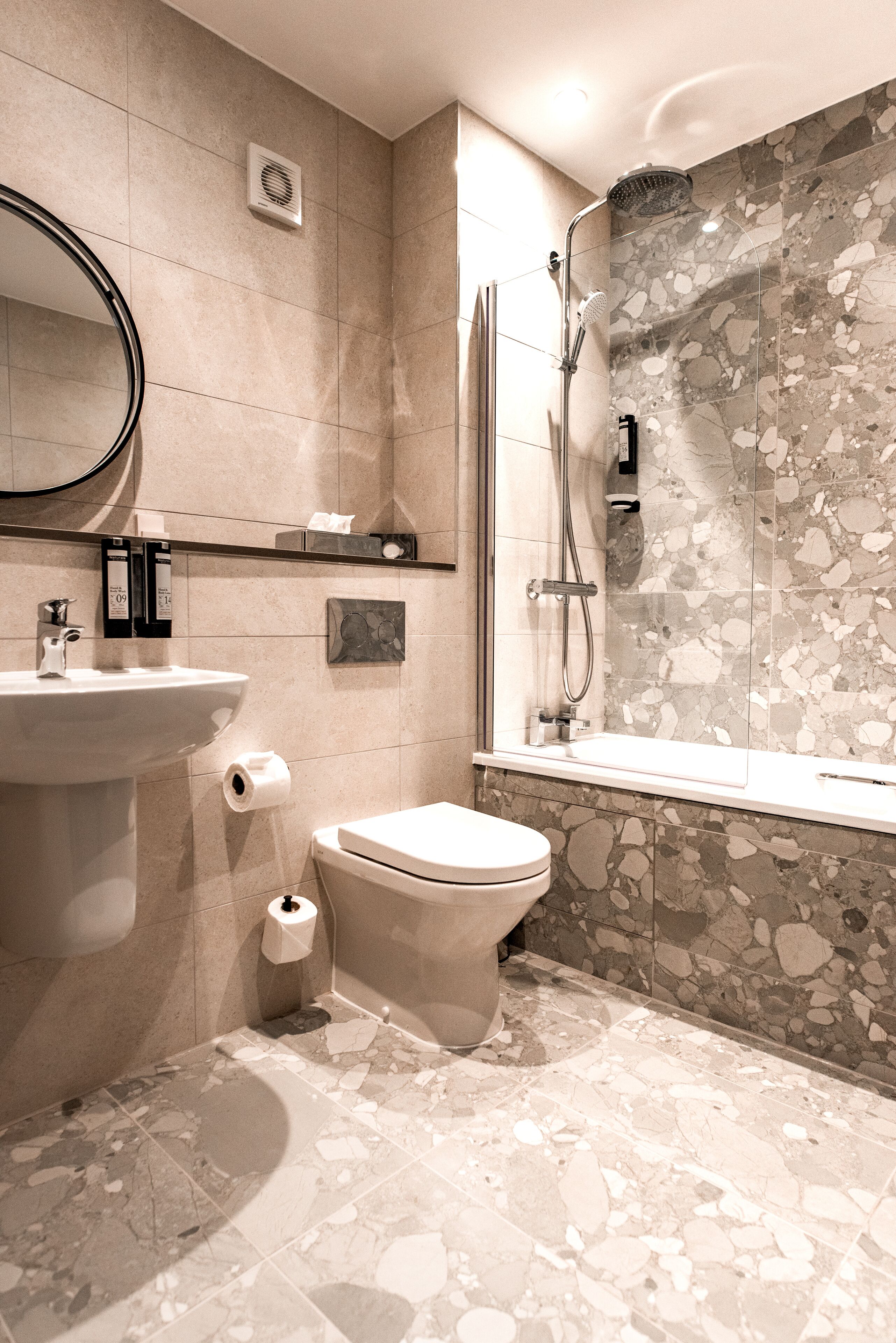 designer toiletries, hair dryer, towels, soap