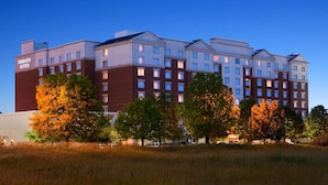 A multi-story hotel with a prominent 'Embassy Suites' sign, featuring a brick facade and uniform window design. - Embassy Suites by Hilton Columbus Dublin (Dublin)