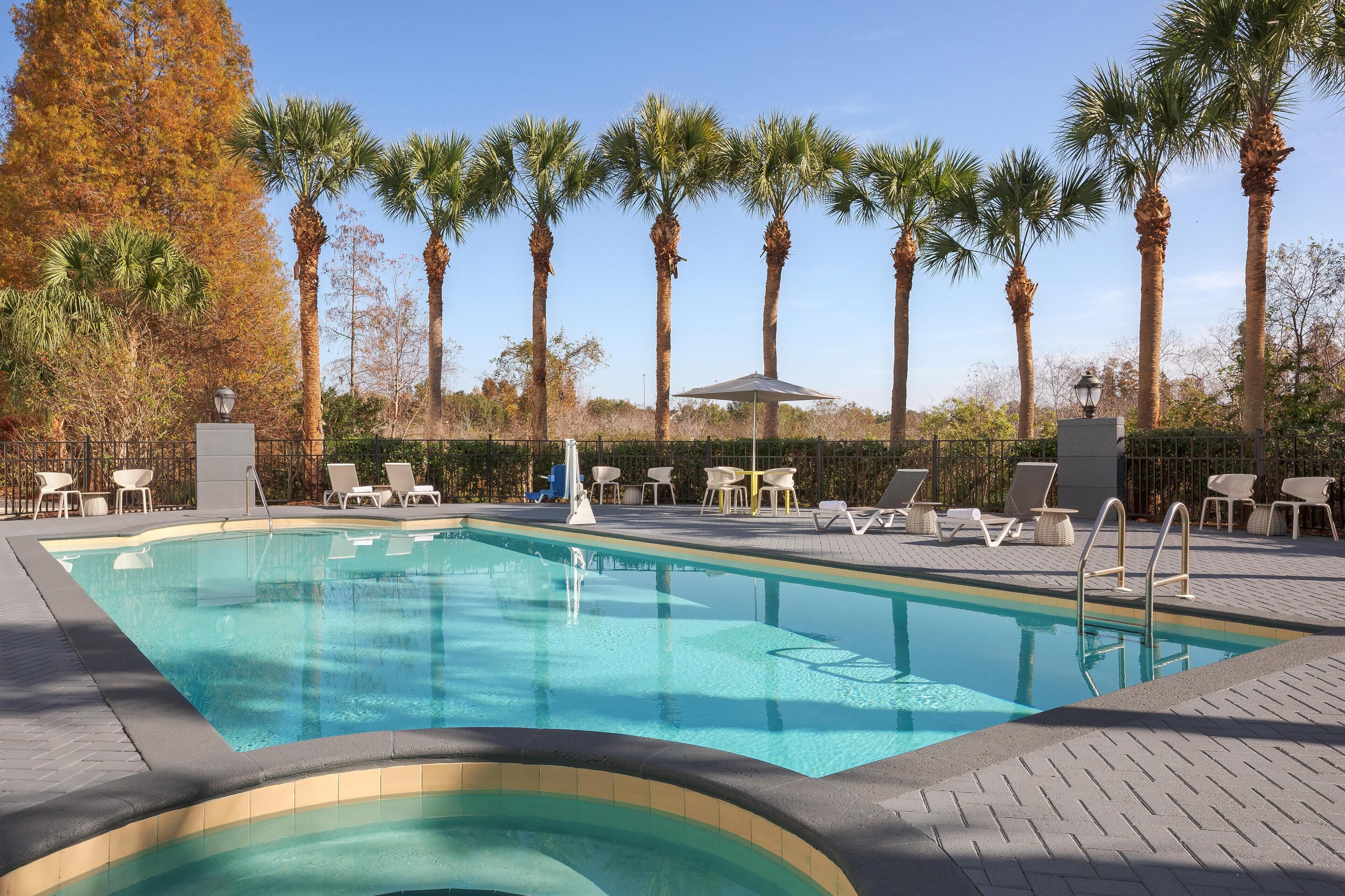 Outdoor pool, pool umbrellas, sun loungers