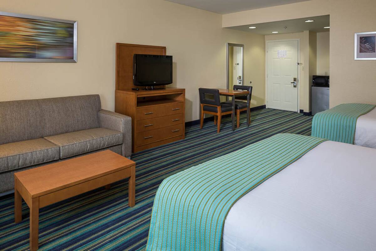 Suite, 1 Bedroom | Desk, laptop workspace, blackout drapes, iron/ironing board