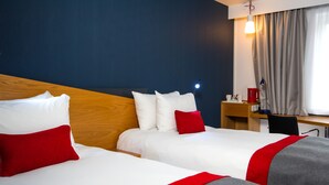 A hotel room with two beds, a desk, and a chair. - Holiday Inn Express Gloucester - South by IHG (Gloucester)
