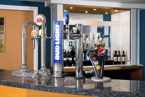 A bar counter with multiple taps including Bud Light, Guinness, Stella Artois, and Pepsi Max. - Holiday Inn Express Manchester East by IHG (Manchester)
