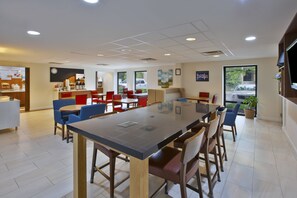 Enjoy meals in this stylish dining area with a large table and comfortable seating.