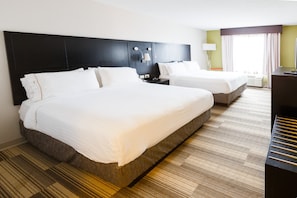 Premium bedding, pillow-top beds, desk, laptop workspace