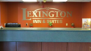 A reception desk with a sign reading "Lexington Inn & Suites". - Lexington Inn & Suites Windsor (Windsor)
