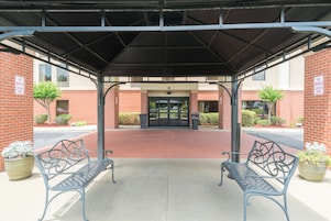 Premium bedding, desk, laptop workspace, blackout drapes