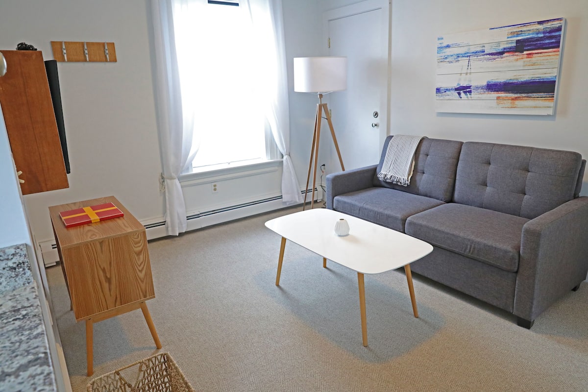 Suite, 1 cama King size y sofá cama | Área de sala de estar | Televisión de pantalla plana