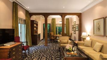 Grande Luxury, Suite, 1 Bedroom, Garden View | Living area | 50-inch LCD TV with satellite channels, TV