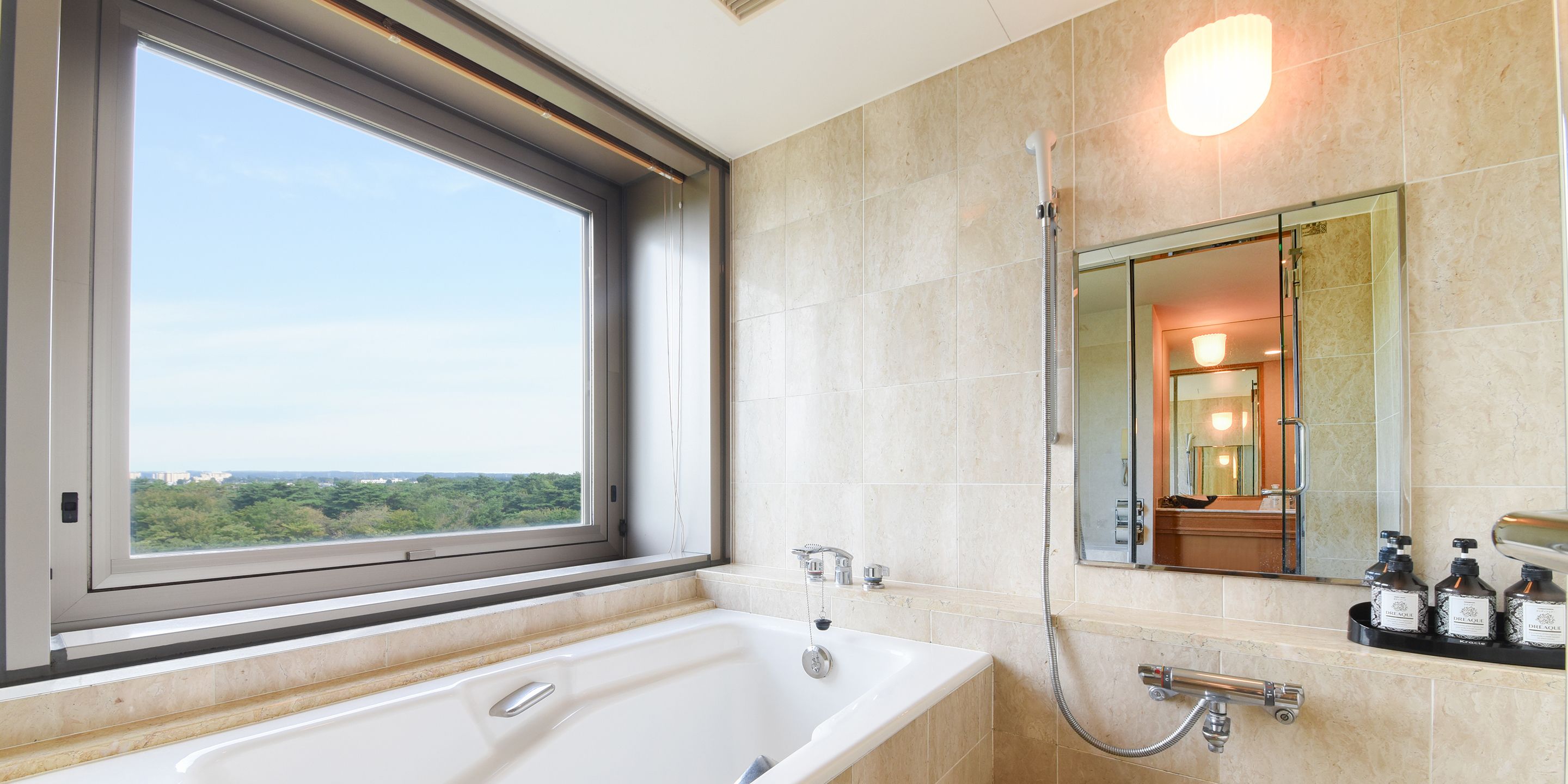 combined shower/bathtub, deep-soaking bathtub, hair dryer, slippers