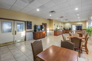 Enjoy meals in a spacious dining area with various seating options and a fully equipped kitchenette.