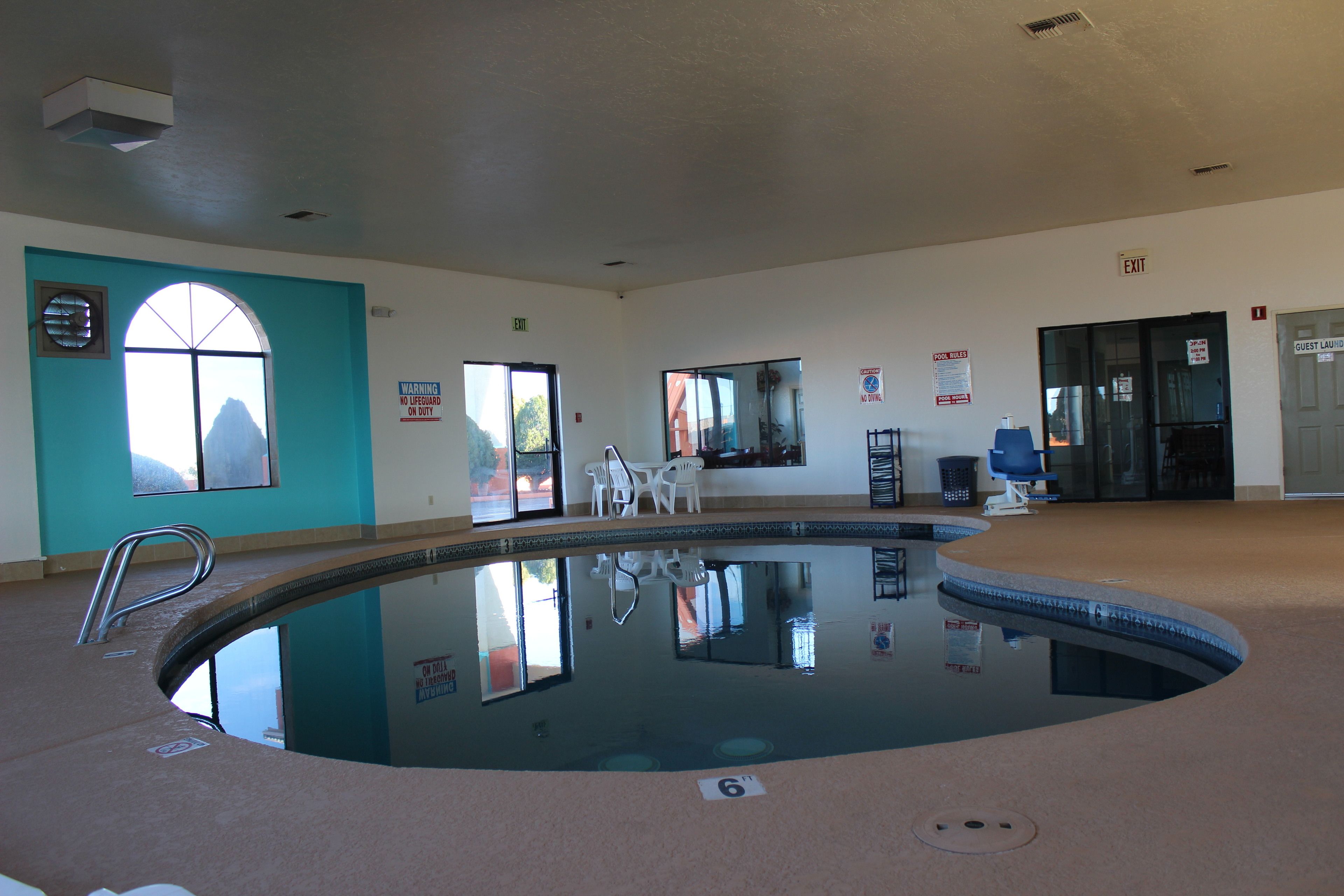 Indoor pool, open 2:00 PM to 11:00 PM, pool loungers