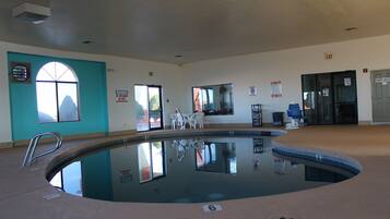 Indoor pool, open 2:00 PM to 11:00 PM, pool loungers