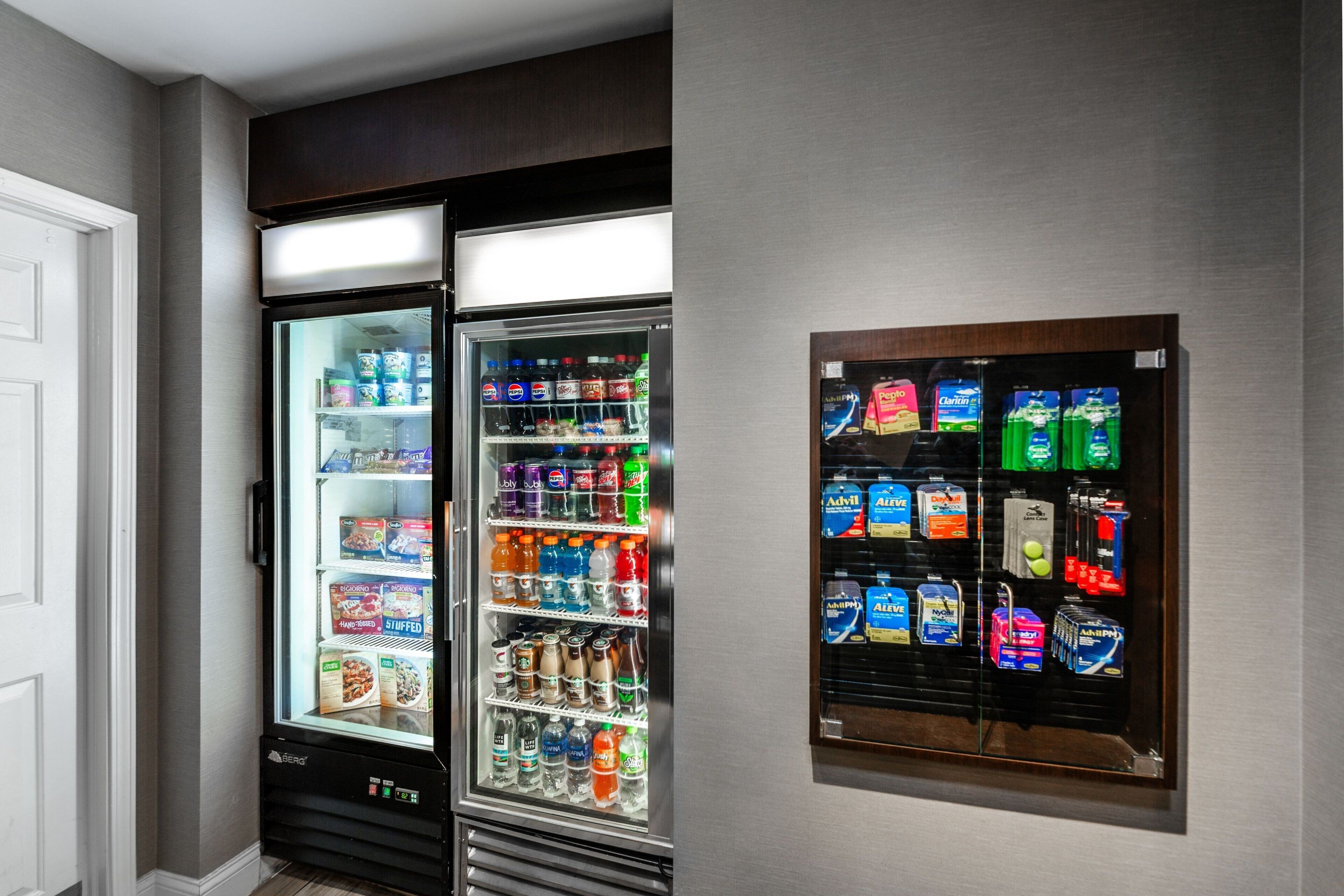 Two beverage dispensers with various drinks and snacks.