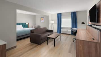 Suite, 1 King Bed with Sofa bed, Non Smoking | In-room safe, desk, laptop workspace, iron/ironing board