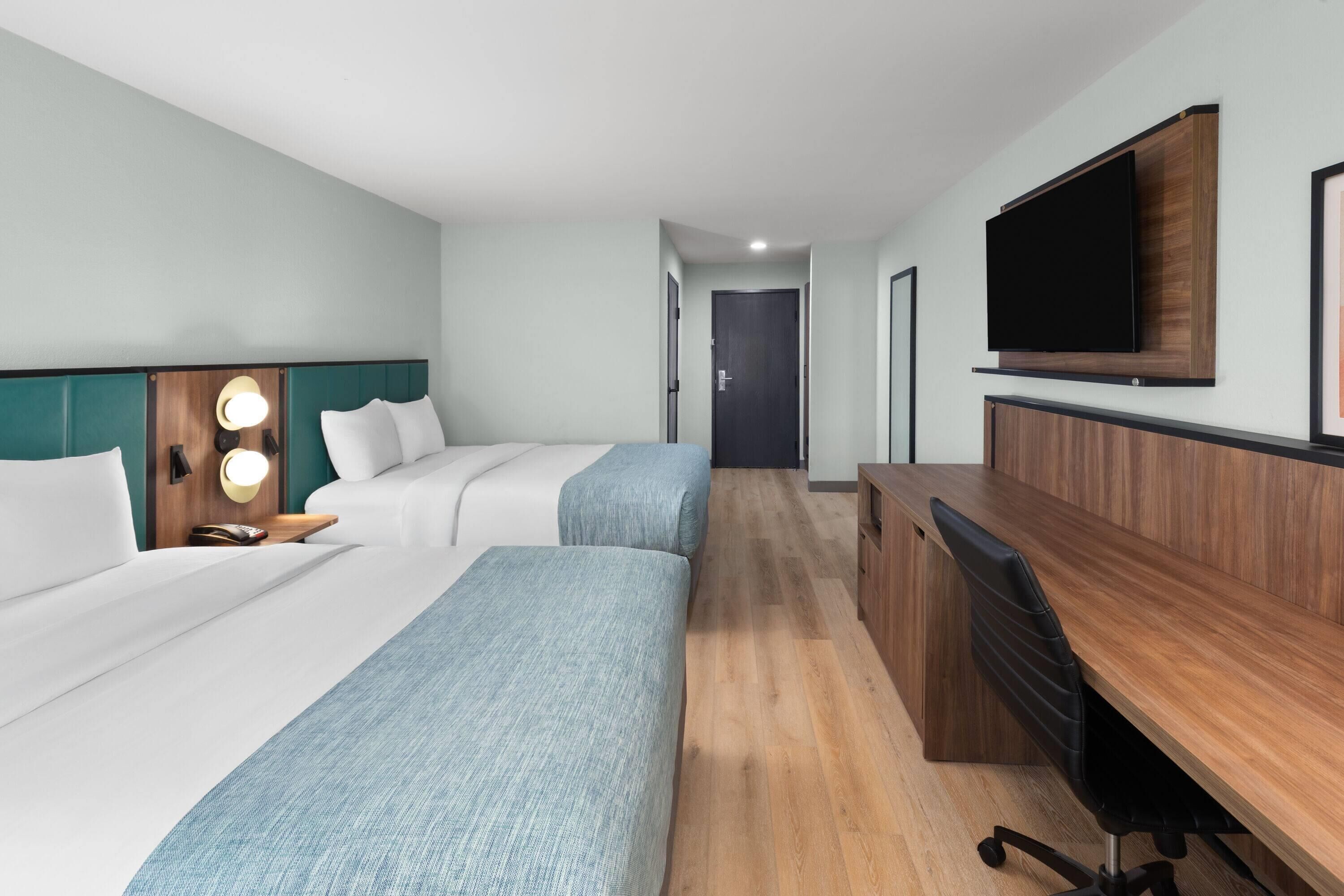 Room, 2 Queen Beds, Non Smoking | In-room safe, desk, laptop workspace, soundproofing