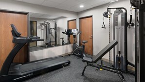 A gym with a treadmill, elliptical, and weight machines. - Wingate by Wyndham Augusta I-20 (Augusta)