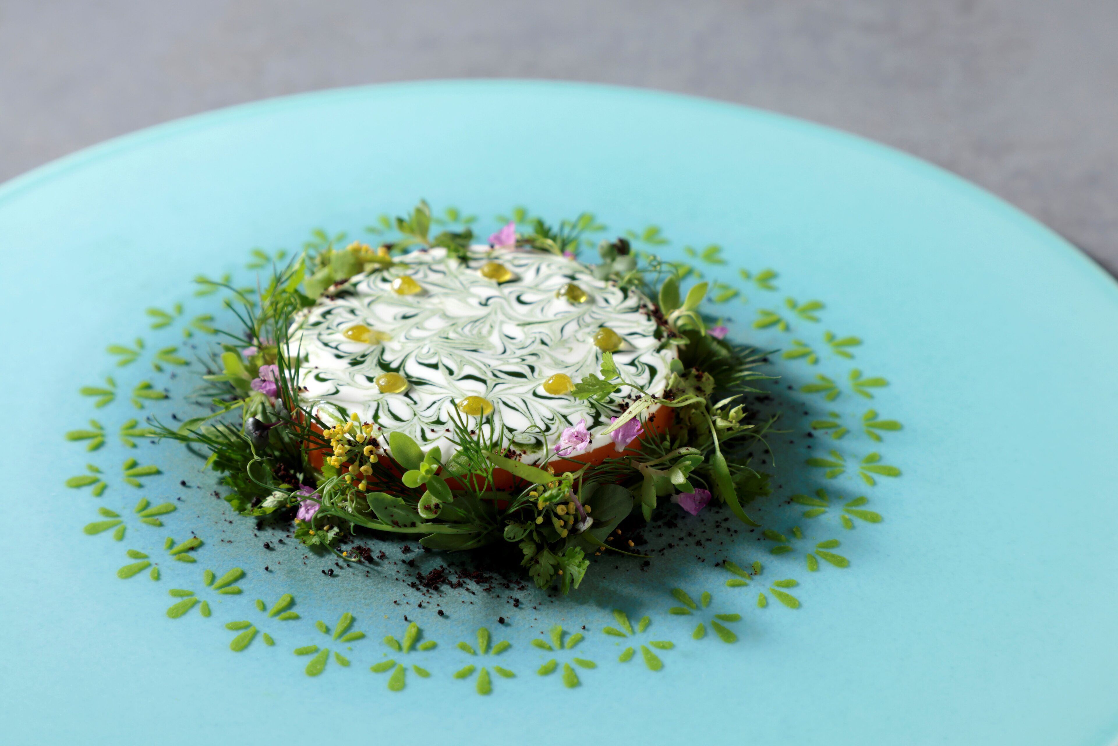 A dessert on a light blue plate with a decorative pattern.