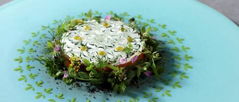A dessert on a light blue plate with a decorative pattern.