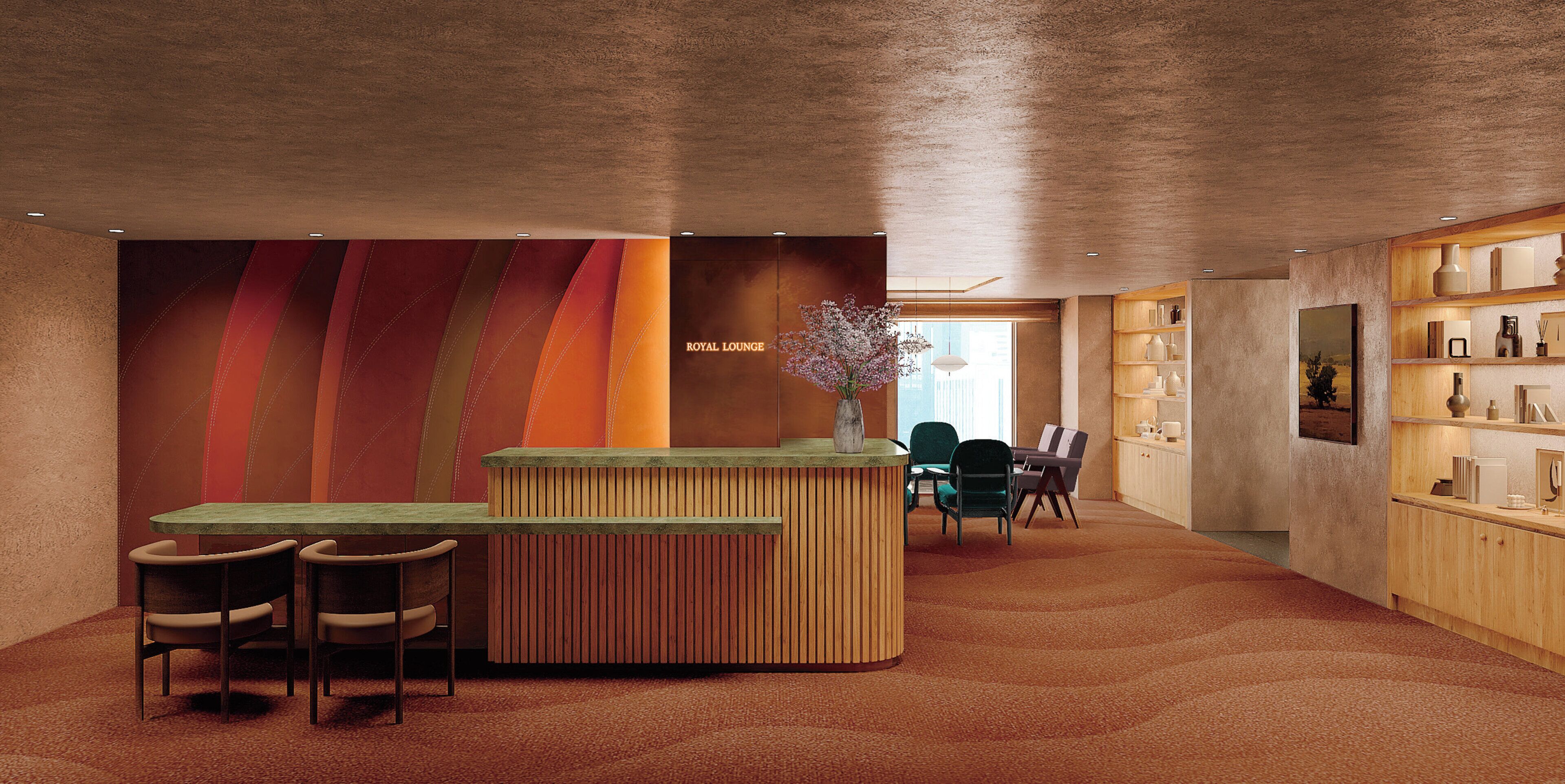 A reception area with a wooden reception desk, two chairs, a vase with flowers, and a bookshelf.