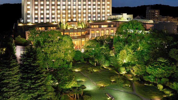 A high-rise hotel with multiple floors, a well-maintained garden, and a clear view of the surrounding area. - RIHGA Royal Hotel Tokyo (Tokyo)