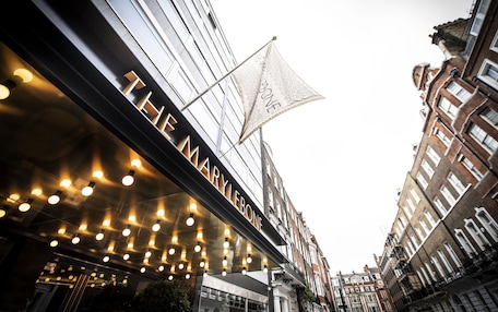 A building with a sign reading "THE MARYLEBONE" and a flag with the same name.