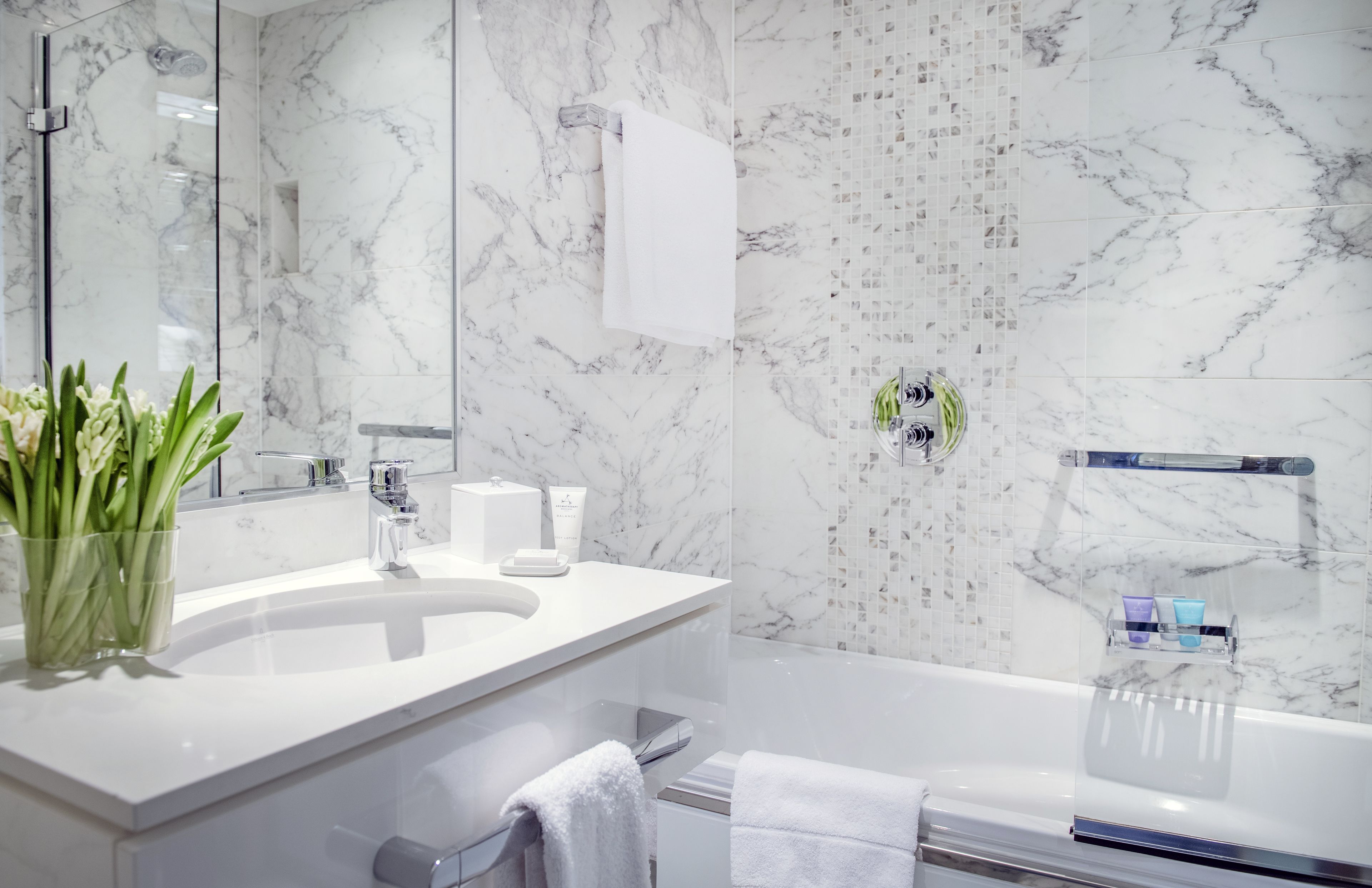 combined shower/bathtub, designer toiletries, hair dryer, bathrobes