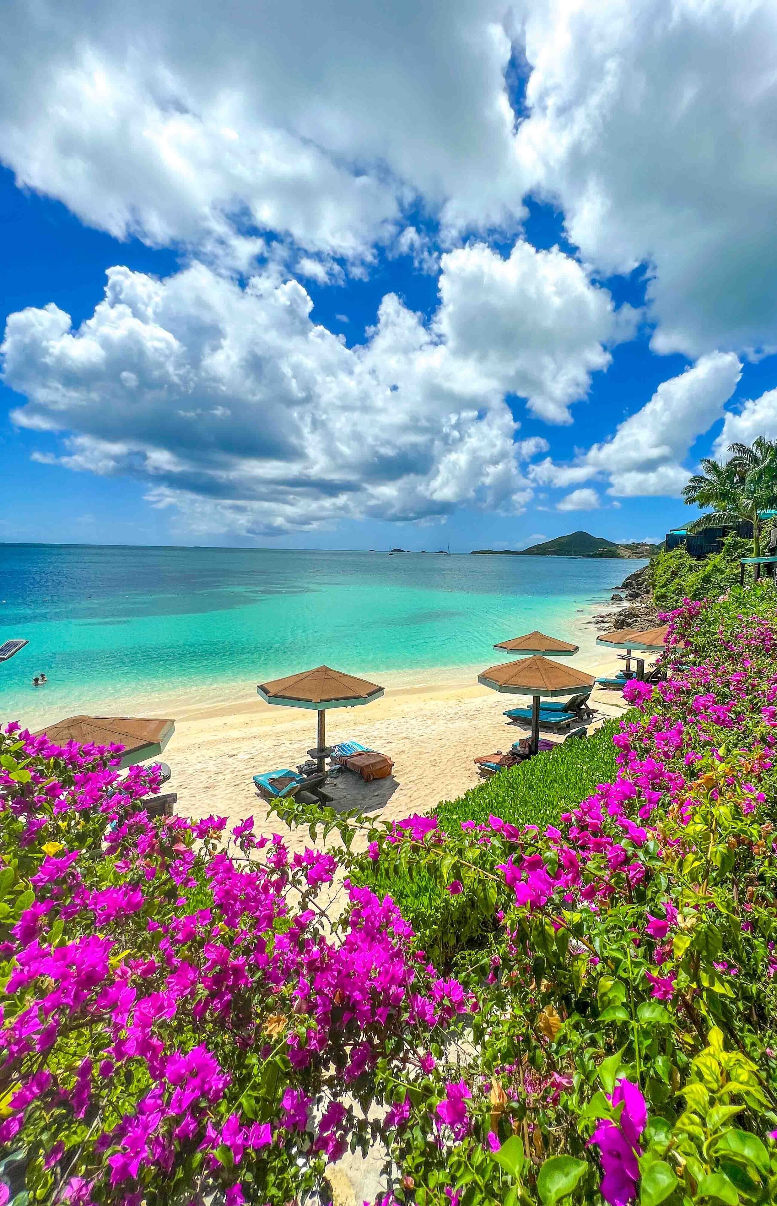 On the beach, white sand, sun-loungers, beach umbrellas