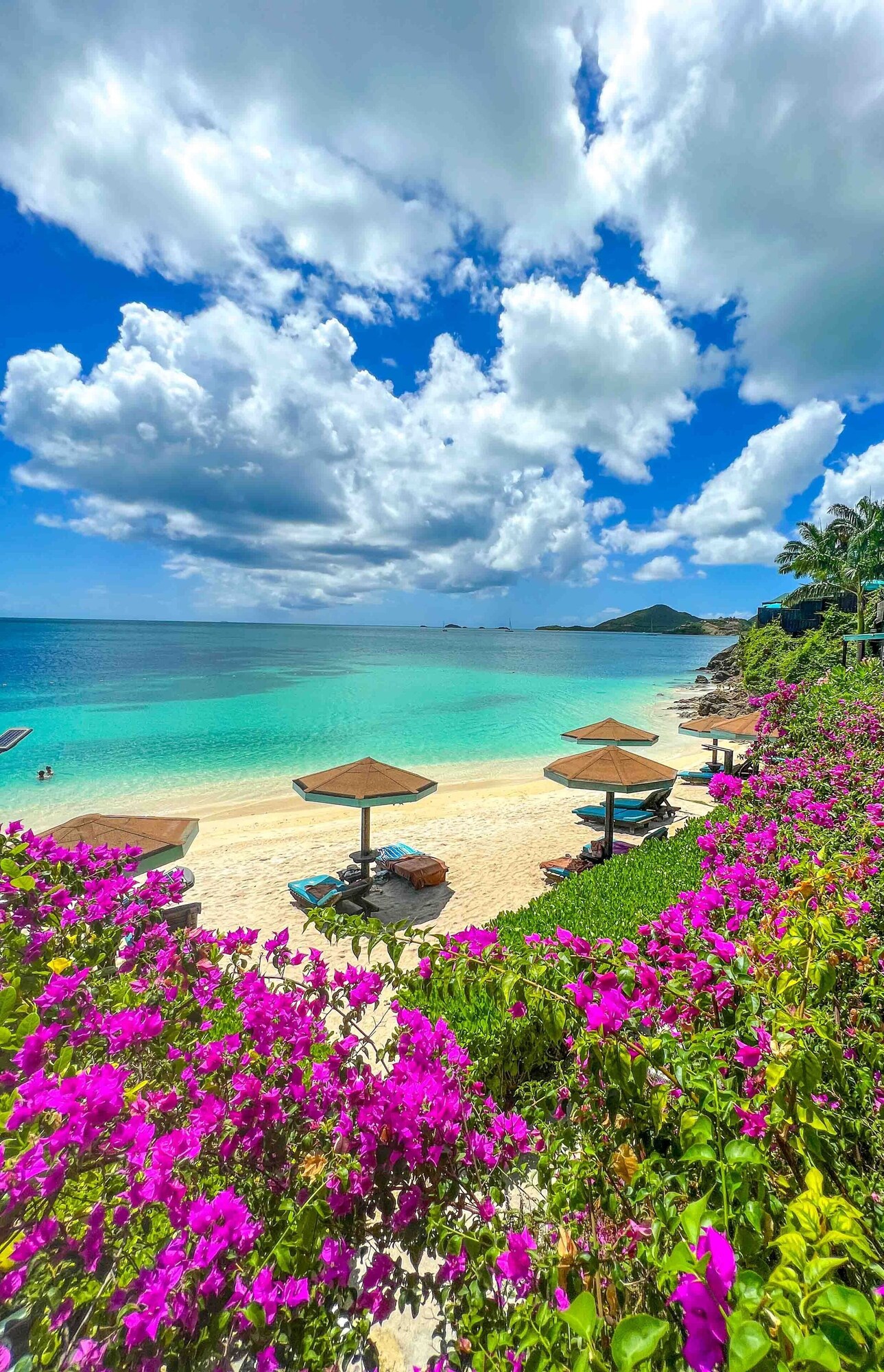 On the beach, white sand, sun-loungers, beach umbrellas