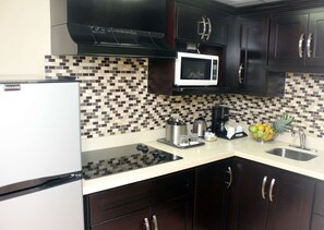 Suite, 1 Bedroom | Private kitchen | Fridge, coffee/tea maker, electric kettle