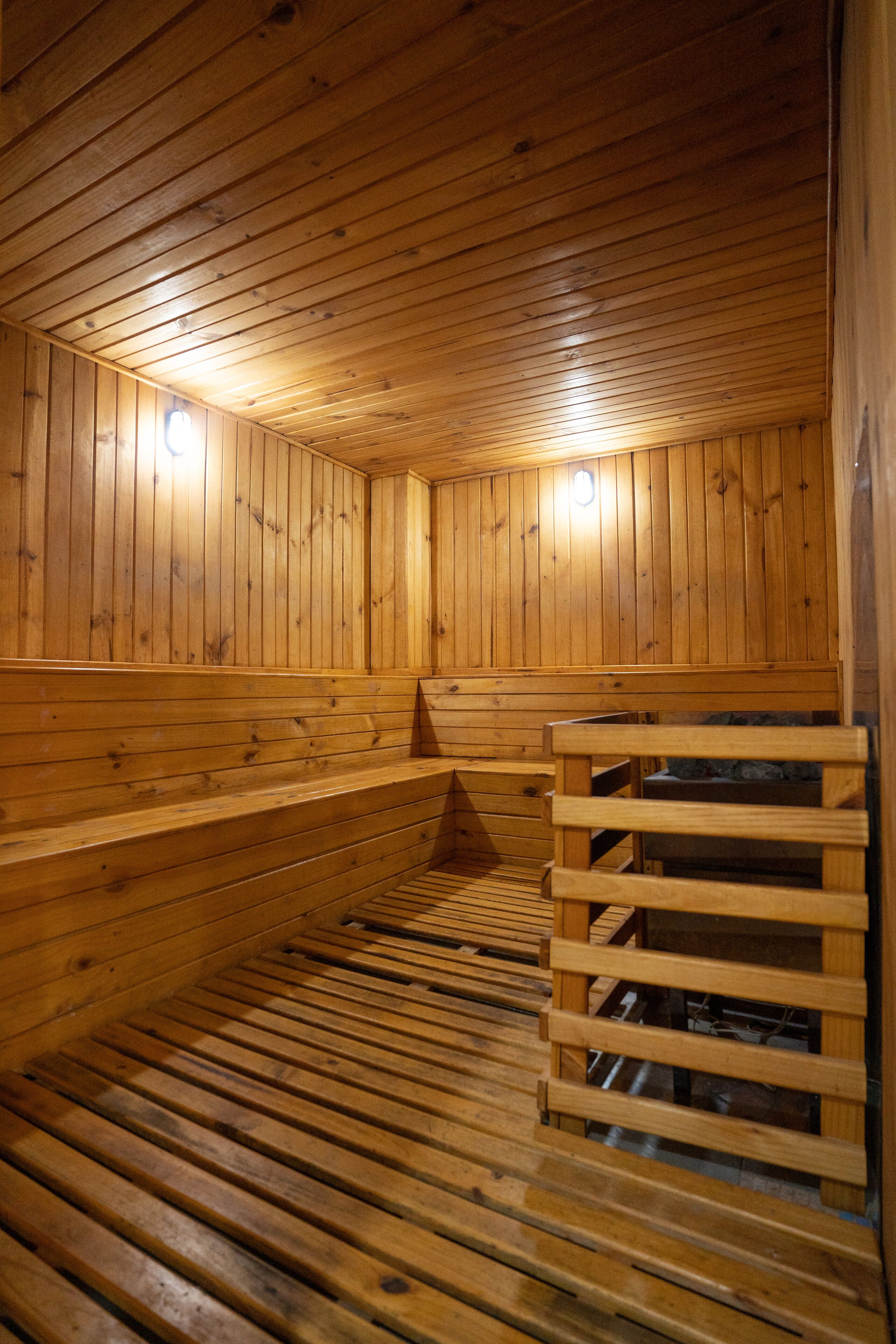 A sauna with wooden walls and benches.