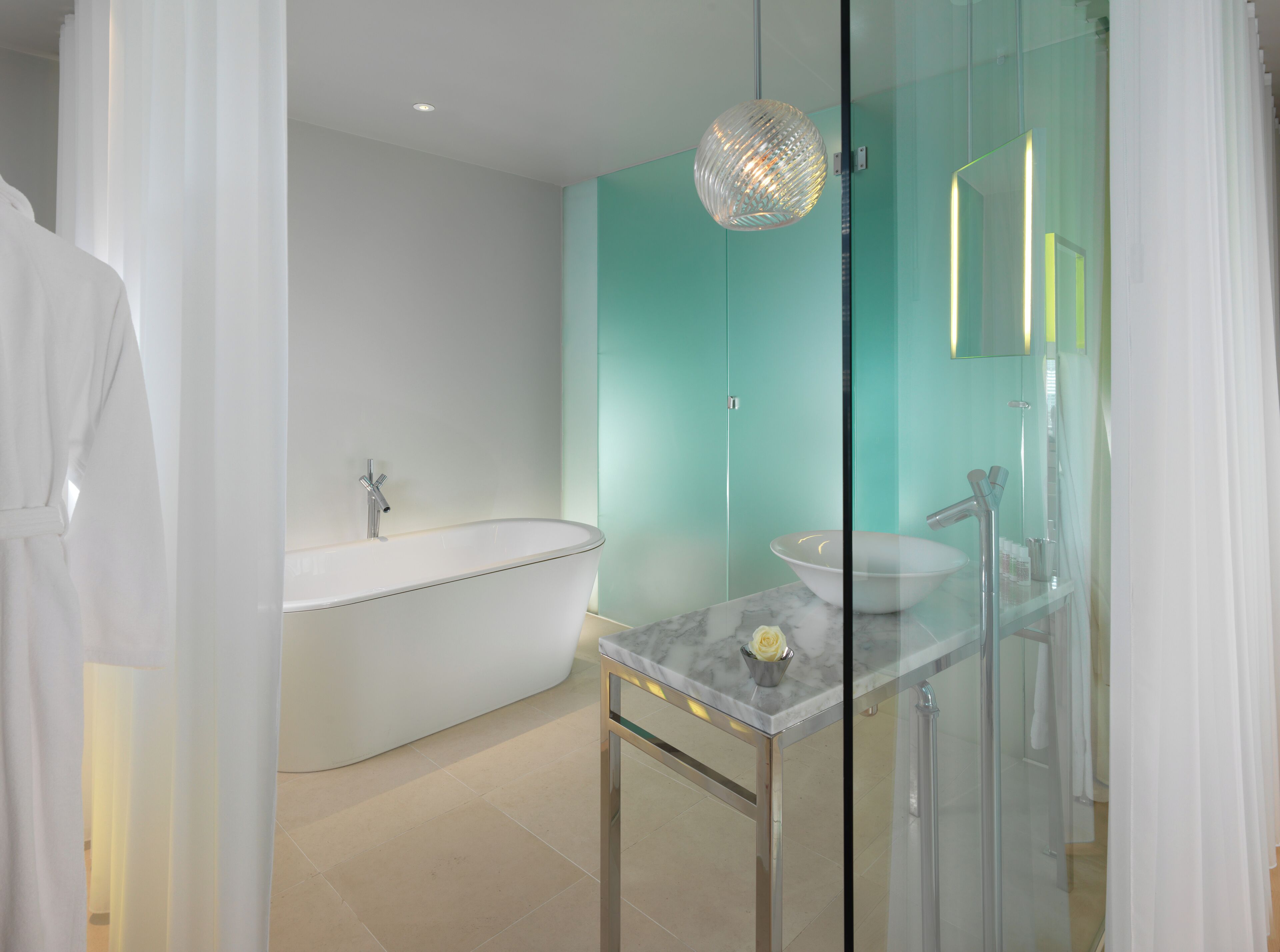 deluxe room, 1 king bed | bathroom | designer toiletries, hair dryer, bathrobes, slippers