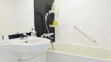 A modern bathroom with a white sink, toilet, and bathtub.