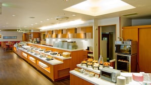 A buffet area with a variety of food items, a coffee station, and a microwave. - Sapporo Tokyu REI Hotel (Sapporo)