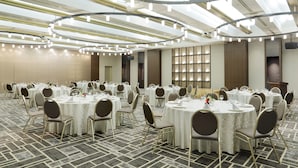 A conference room with multiple round tables, each set with chairs and tableware. - Sapporo Tokyu REI Hotel (Sapporo)