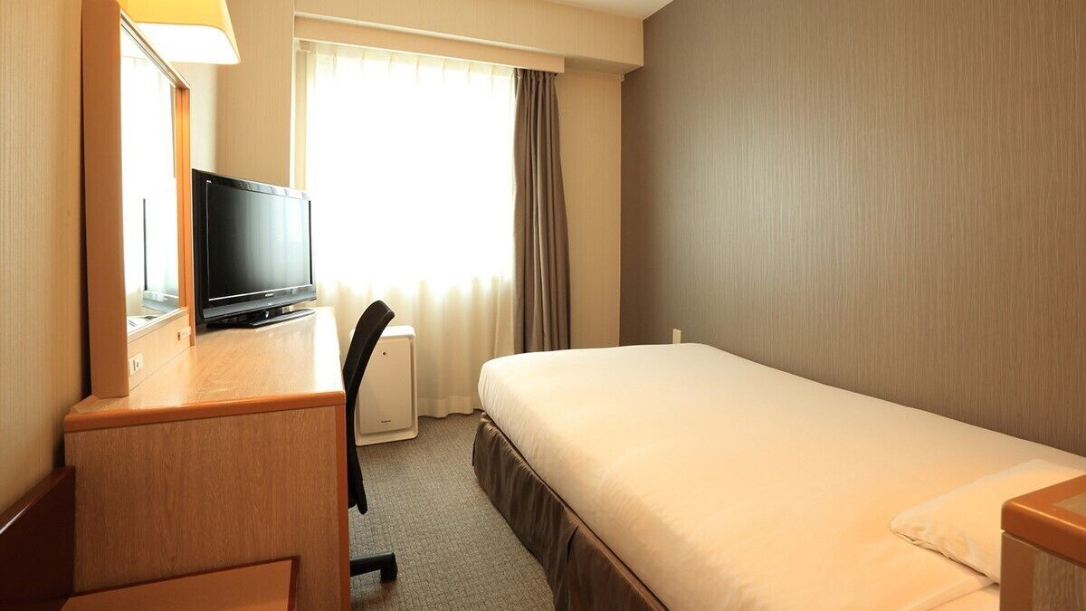 Down comforters, desk, blackout drapes, iron/ironing board