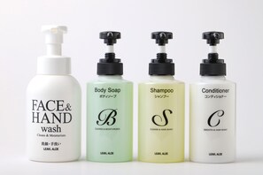 Four bottles of personal care products: face and hand wash, body soap, shampoo, and conditioner. - Smile Hotel Shimonoseki (Shimonoseki)