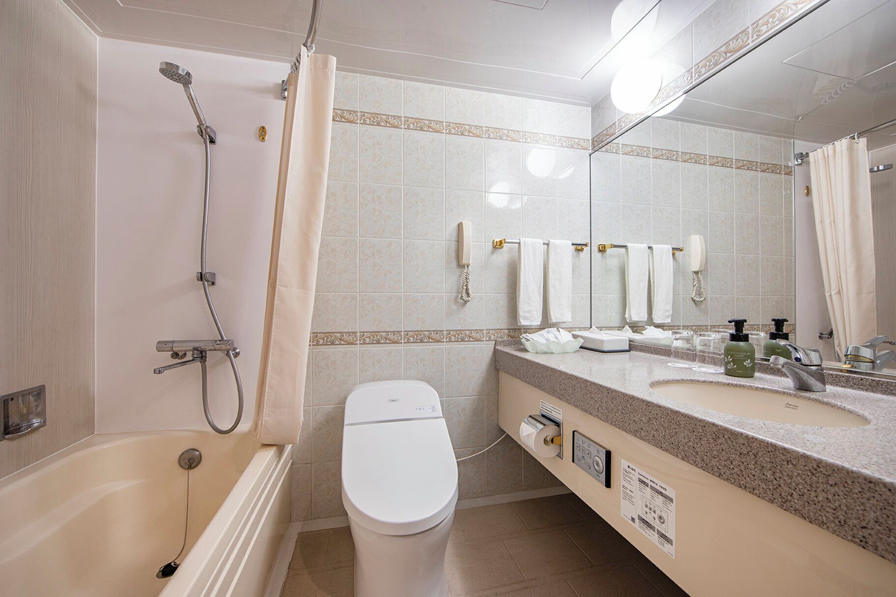 combined shower/bathtub, hair dryer, slippers, electronic bidet