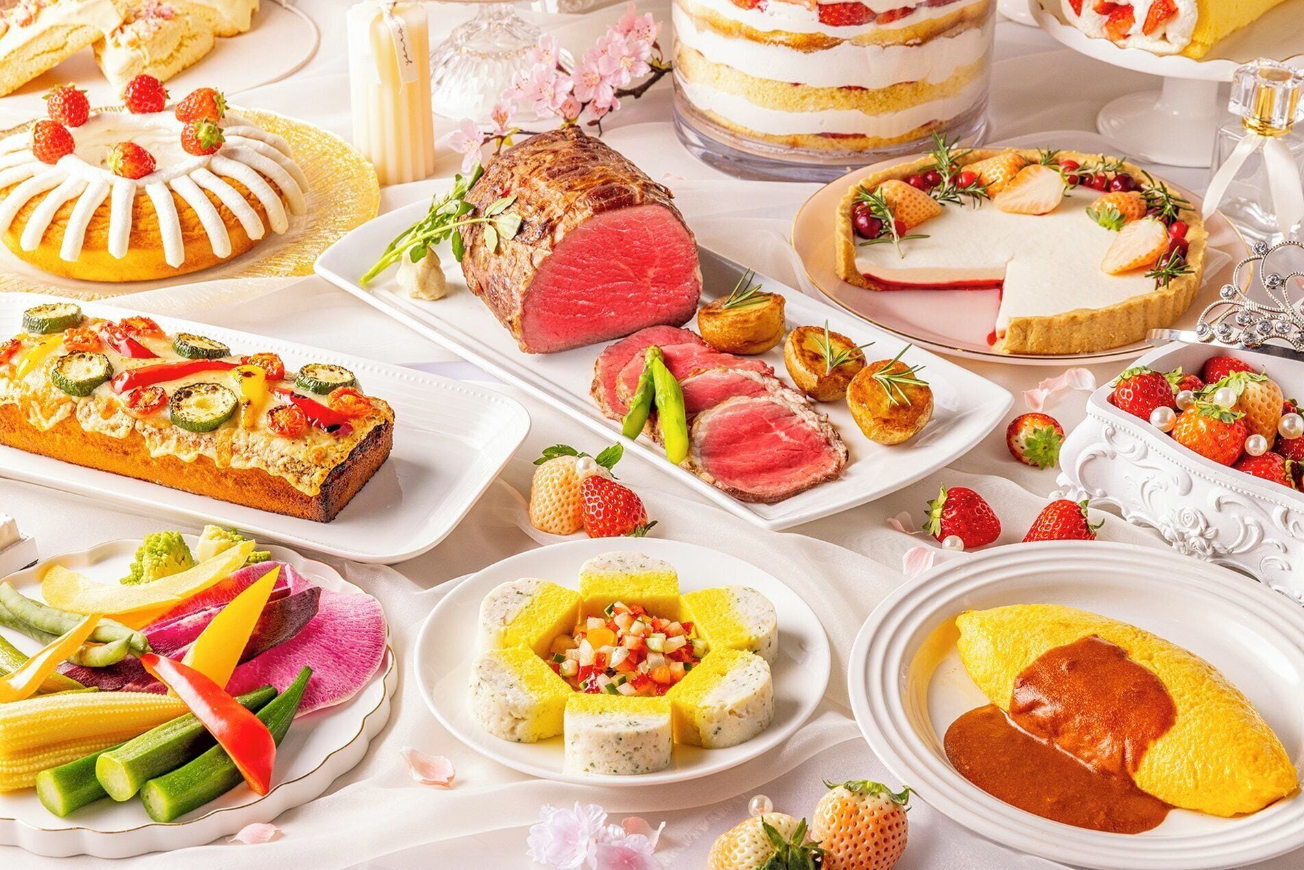 A variety of dishes including a steak, a layered cake, and a fruit tart, suggesting a buffet-style meal.