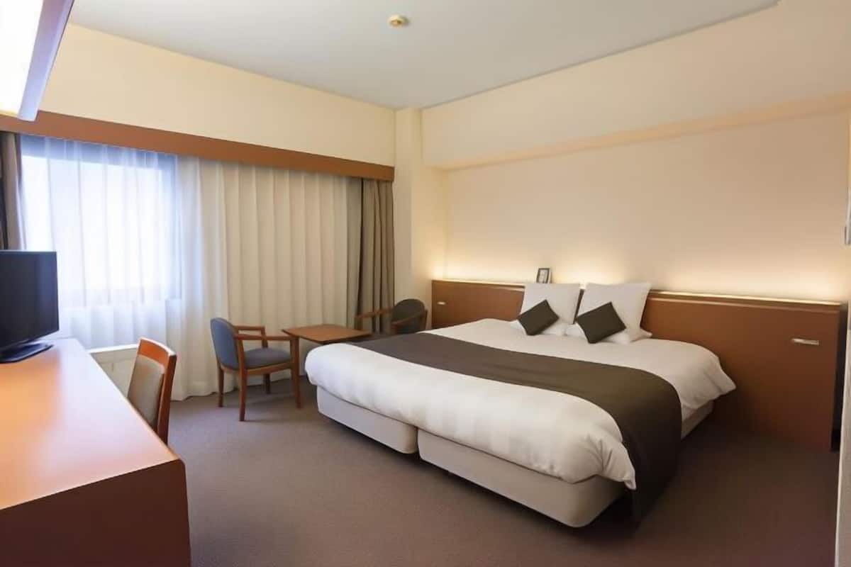 Desk, blackout curtains, bed sheets