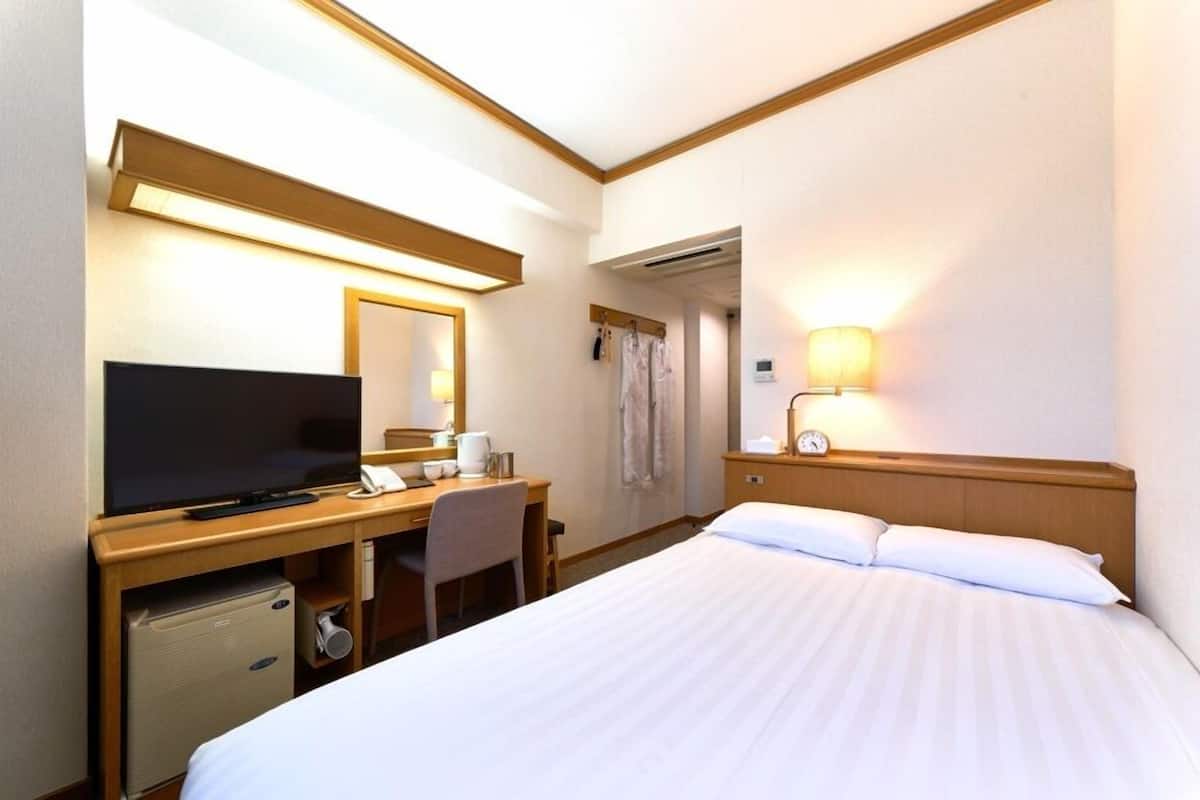 Desk, blackout curtains, bed sheets