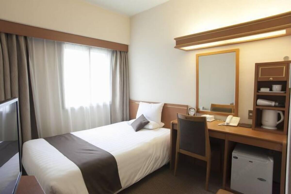 Desk, blackout curtains, bed sheets