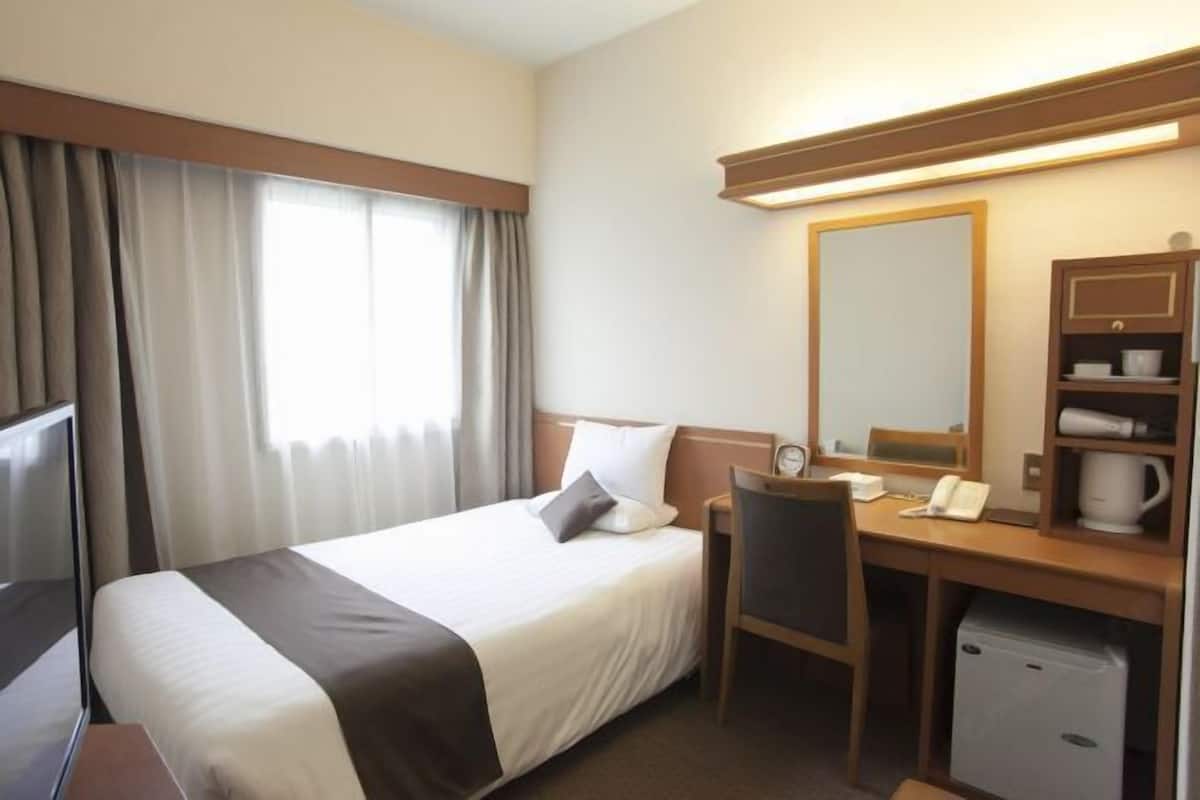 Desk, blackout curtains, bed sheets