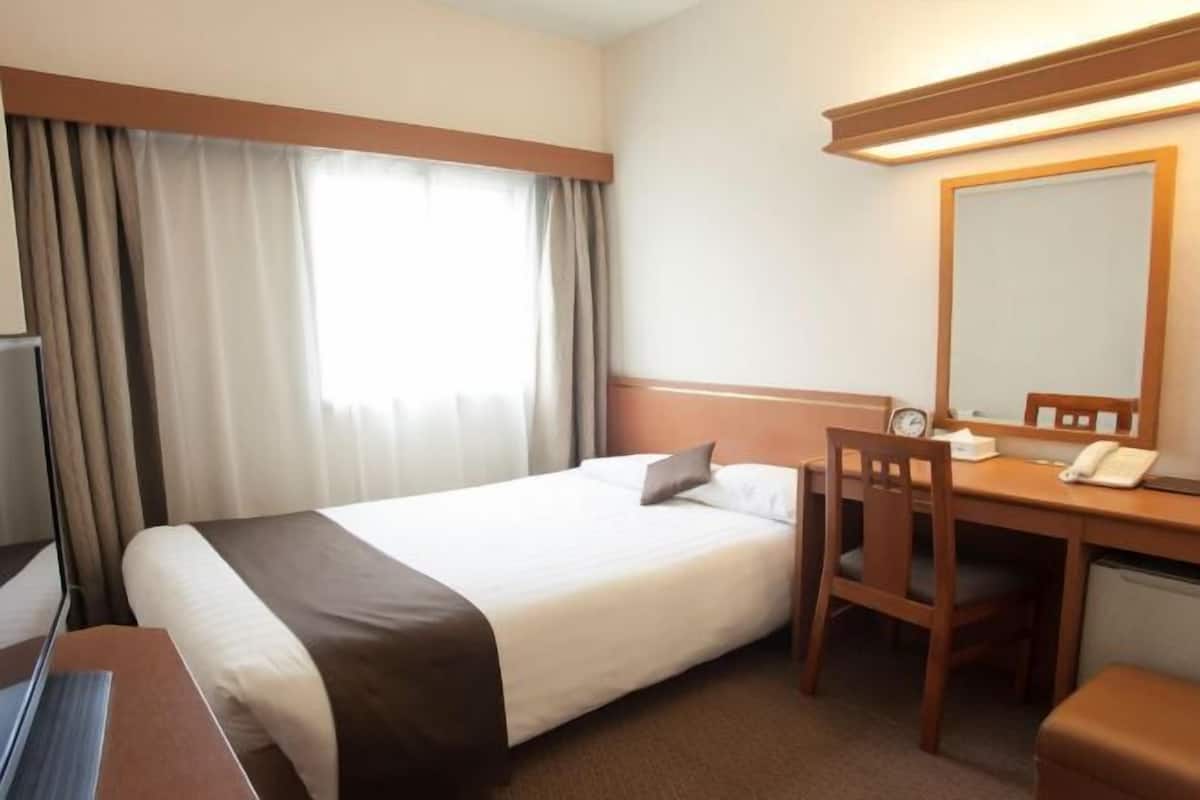 Desk, blackout curtains, bed sheets