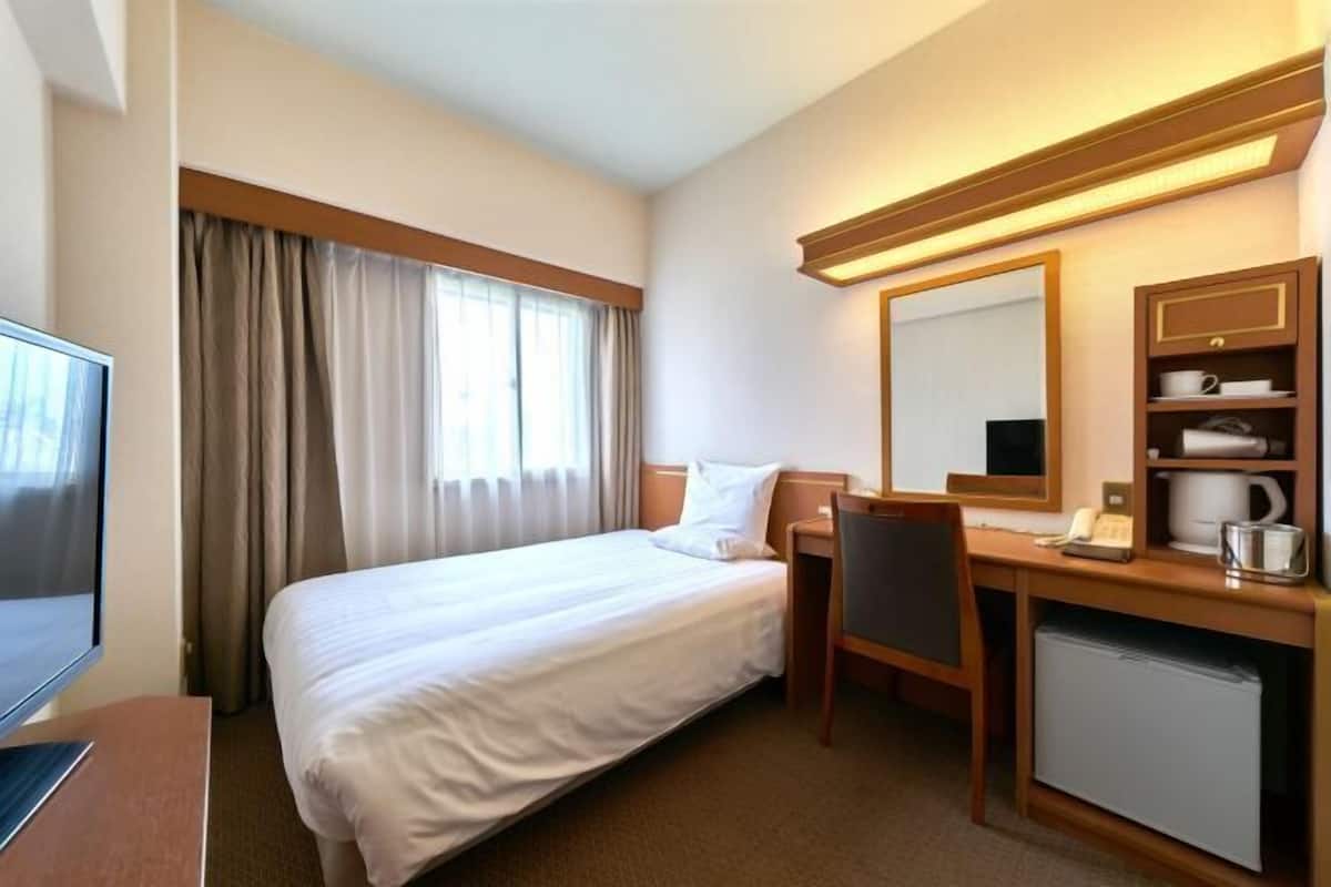 Desk, blackout curtains, bed sheets