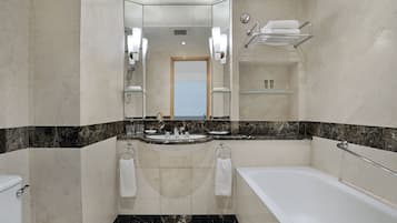 Combined shower/bathtub, hair dryer, slippers, towels