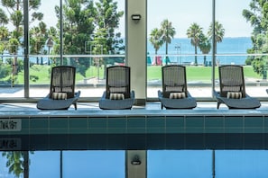 Indoor pool, open 5:00 AM to 10:00 PM, pool loungers