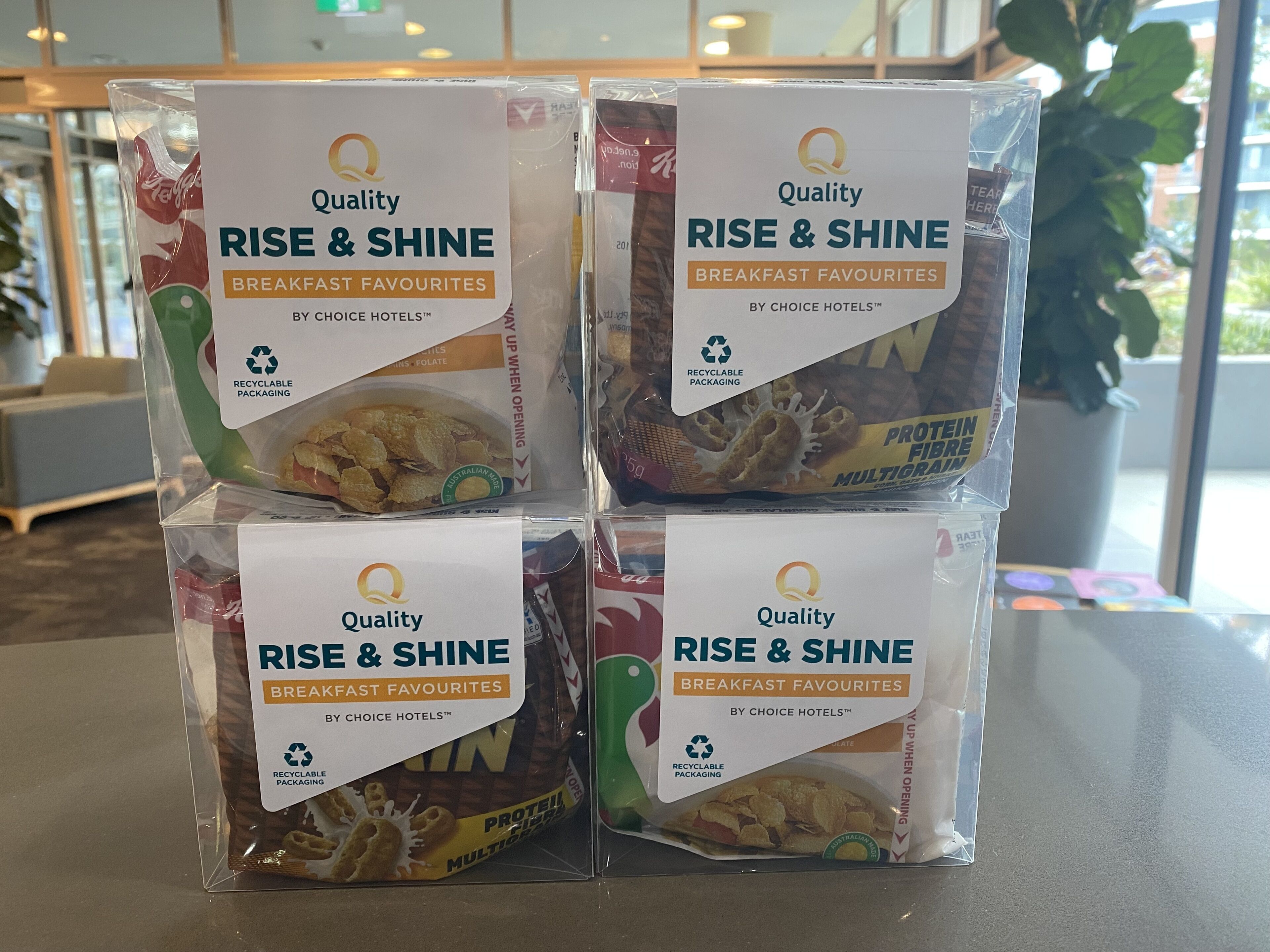 Four packages of 'Quality Rise & Shine Breakfast Favourites' in recyclable packaging.