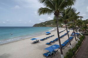 On the beach, white sand, free beach cabanas, sun loungers