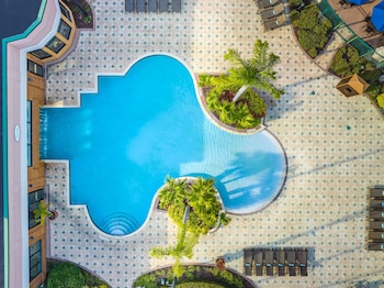 Indoor pool, 3 outdoor pools, open 7:00 AM to 10 PM, pool umbrellas at Courtyard Orlando Lake Buena Vista in the Marriott Village