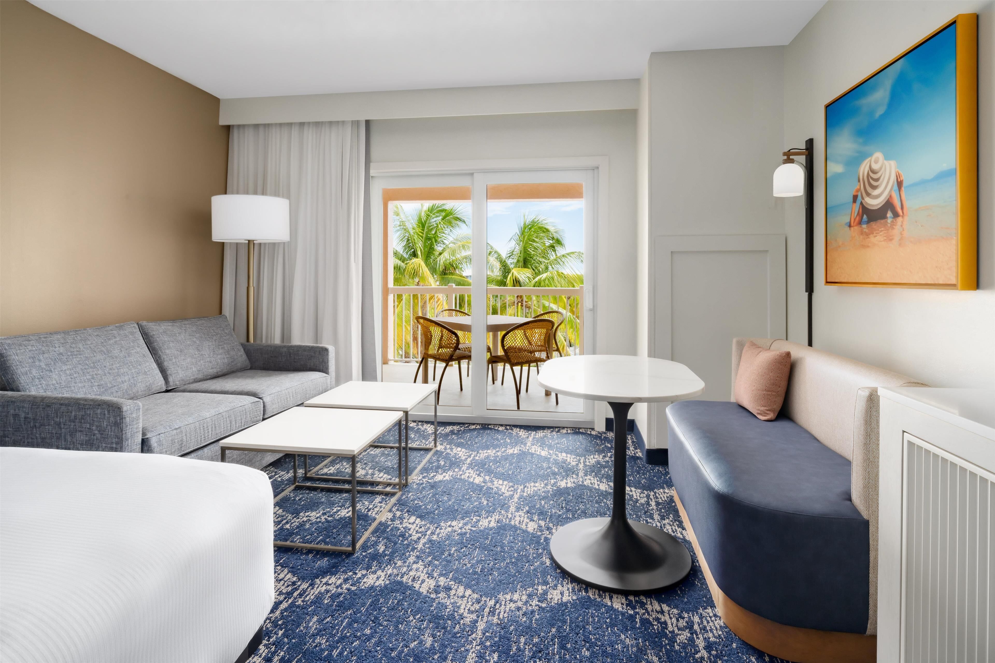 two queens with balcony | living area | 40-inch led tv with cable channels, tv, pay films